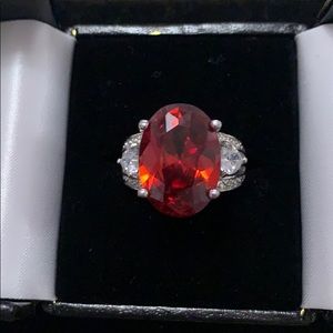 Size 8 silver ring, massive blood red gemstone.